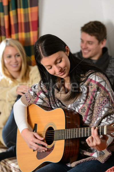 Young friends in winter cottage play guitar  Stock photo © CandyboxPhoto