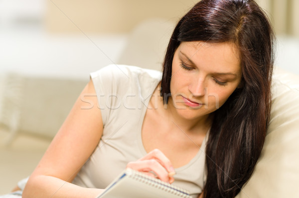 Young woman writing letter to copybook Stock photo © CandyboxPhoto