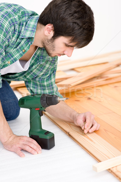 Home improvement - handyman installing wooden floor Stock photo © CandyboxPhoto