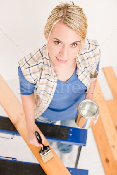 Home improvement - handywoman painting wooden plank Stock photo © CandyboxPhoto