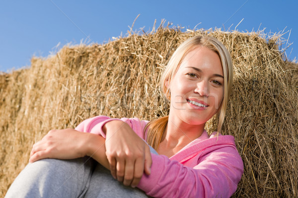 Sportive young woman relax by bales sunset Stock photo © CandyboxPhoto