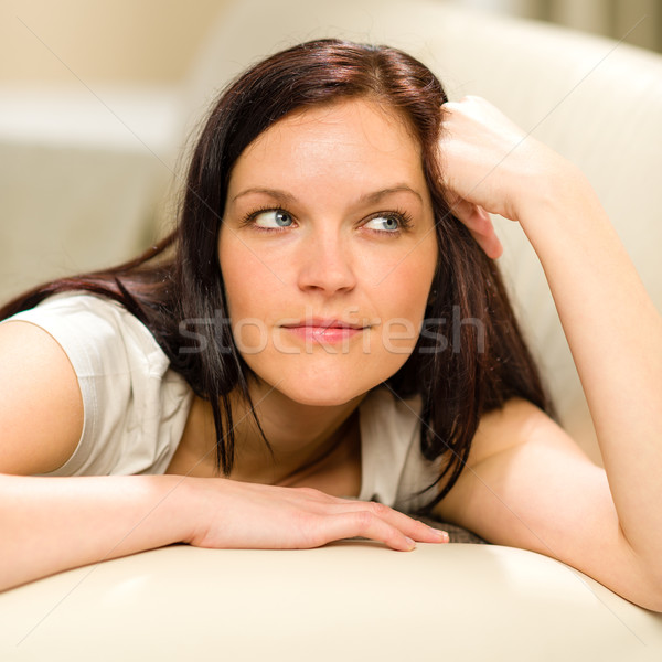 Thinking pensive woman lying in living room Stock photo © CandyboxPhoto