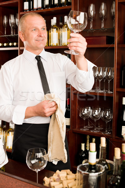 Stock photo: Wine bar waiter clean glass in restaurant