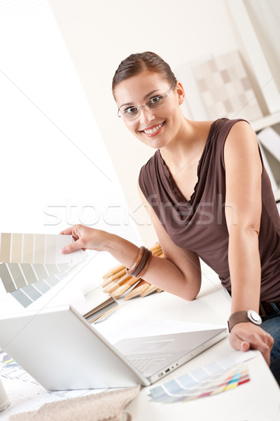 Smiling female designer with color swatch at office Stock photo © CandyboxPhoto