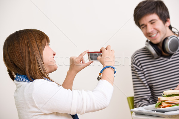 Students - happy teenage couple taking photo with camera Stock photo © CandyboxPhoto