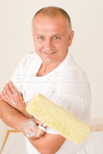 Home decorating mature man with paint roller Stock photo © CandyboxPhoto