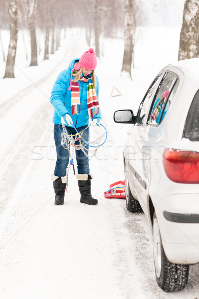Woman snow standing with car tire chains Stock photo © CandyboxPhoto