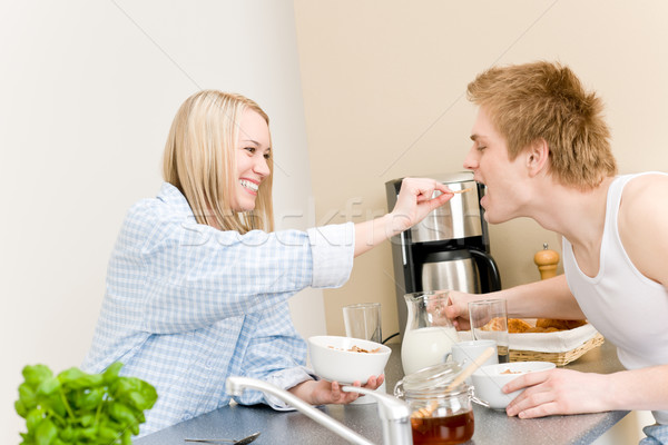 Breakfast happy couple woman feed man cereal Stock photo © CandyboxPhoto