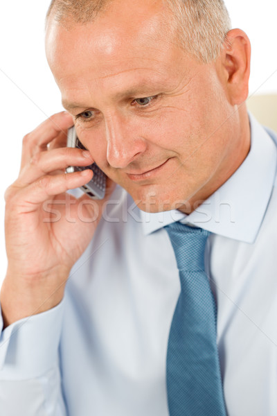 Stock photo: Smiling businessman on phone close-up portrait