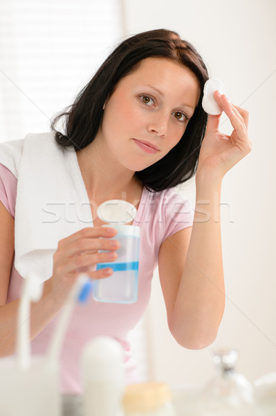 Woman cleaning face with cotton pad bathroom Stock photo © CandyboxPhoto