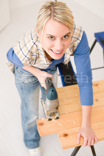 Home improvement - handywoman cutting wooden floor Stock photo © CandyboxPhoto
