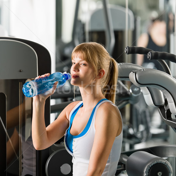 Woman drink water at fitness machine Stock photo © CandyboxPhoto
