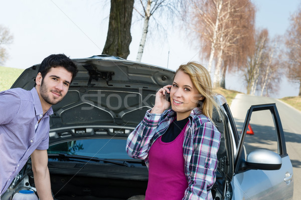 Stock photo: Car breakdown couple calling for road assistance