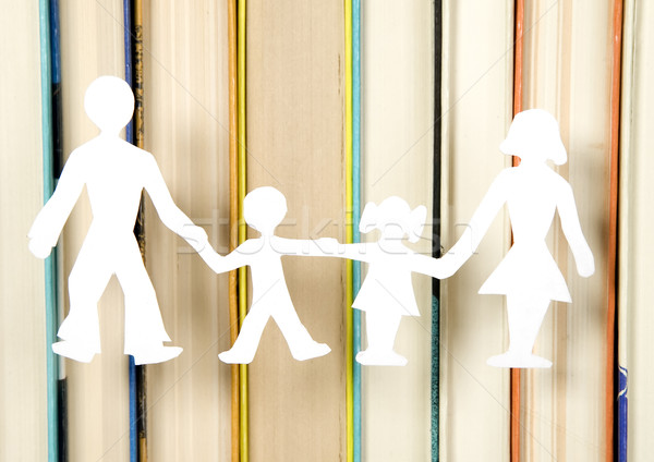 Family figures made from paper with books background Stock photo © carenas1