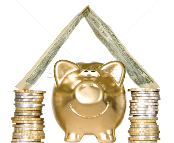 Golden piggybank with money home Stock photo © carenas1