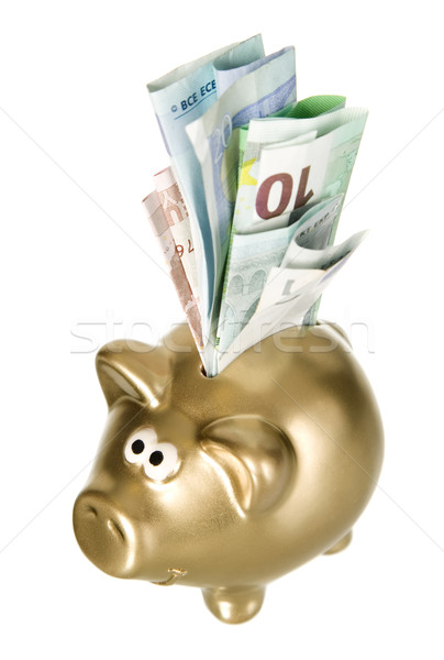 Golden piggybank with paper money Stock photo © carenas1