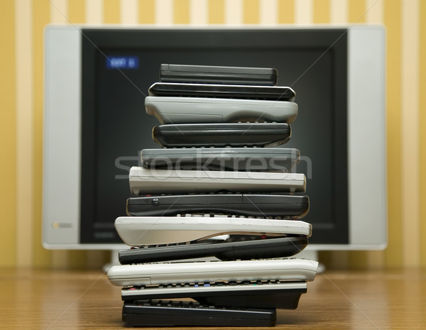 Many tv controllers near televisor Stock photo © carenas1