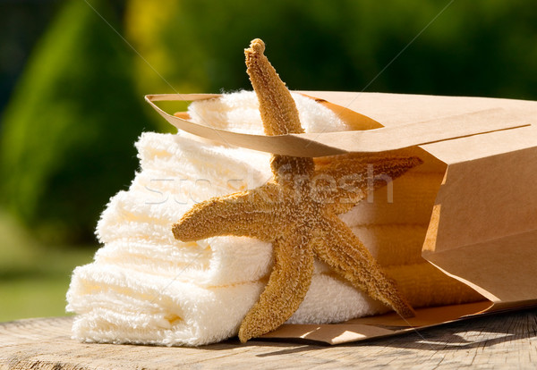 Towels with paper bag and sea star Stock photo © carenas1