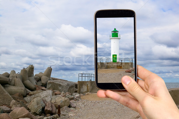 Stock photo: Man is taking photo of lighthouse