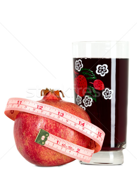 Tasteful fruit garnet with measuring tape Stock photo © carenas1