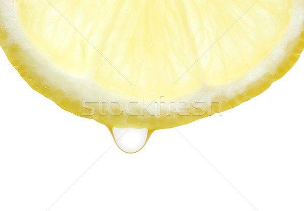 Limón gota de agua rebanada caída blanco jugo Foto stock © carenas1