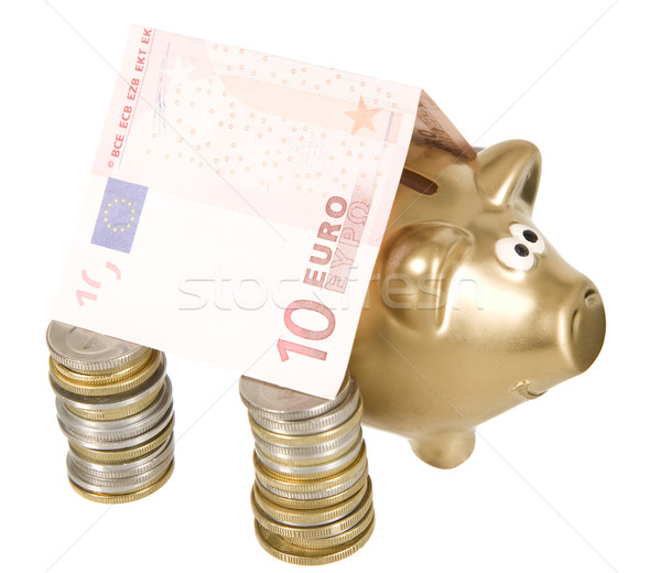 A golden moneybank under house made from banknote Stock photo © carenas1