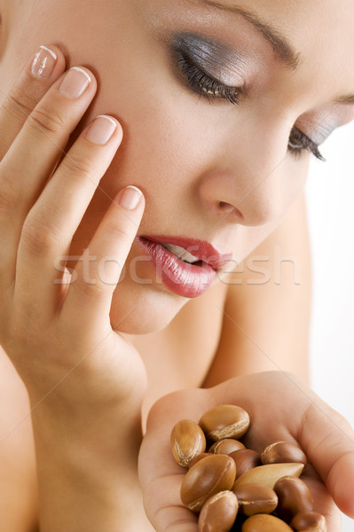 beauty girl with argan seed Stock photo © carlodapino