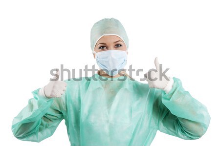 young nurse posing with mask Stock photo © carlodapino