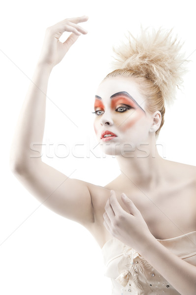 the color makeup as a doll, her left arm is raised up Stock photo © carlodapino