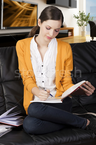 the girl reading a book with absorbed axpression Stock photo © carlodapino