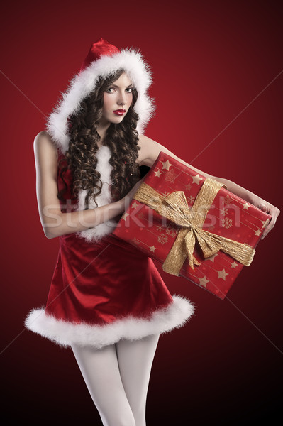 santa claus girl with huge red gift box Stock photo © carlodapino