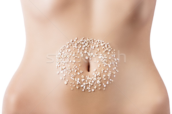 composition of cereals over belly Stock photo © carlodapino