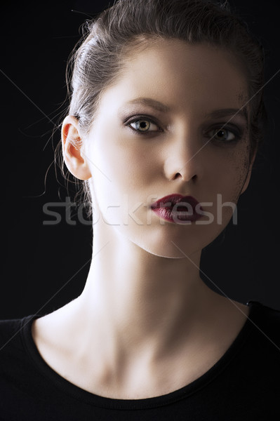 fashion low key portrait she looks in to the lens Stock photo © carlodapino