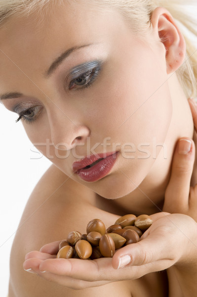 beauty girl with argan seed Stock photo © carlodapino