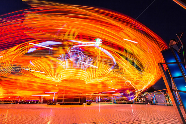 Carousels at night Stock photo © castenoid