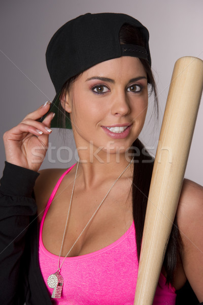 Pretty Female Baseball Lover Adjusts Hat Holding Wooden Bat Stock photo © cboswell