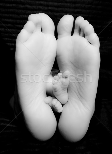 Bare Feet of Proud Mother and Newborn Baby Child  Stock photo © cboswell