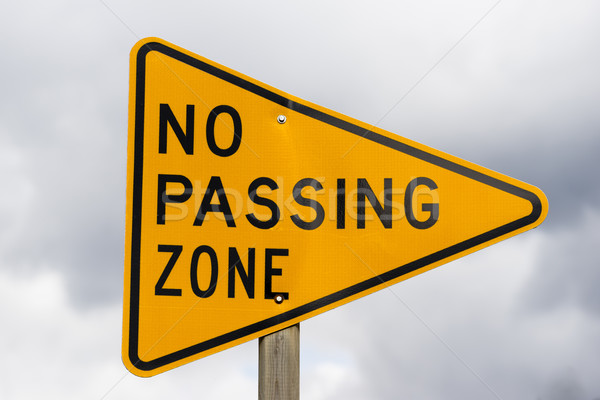 Yellow Triangle Road Sign Warning No Passing Zone Stock photo © cboswell