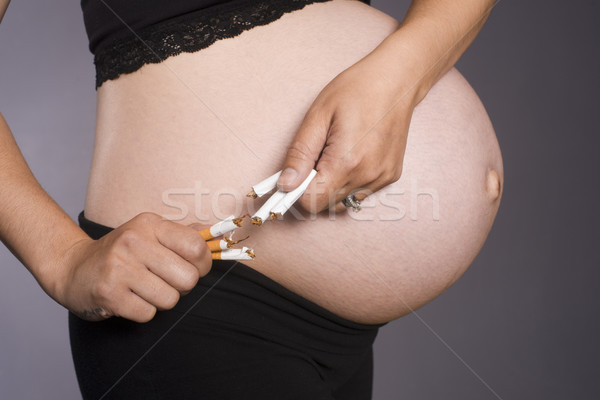Terhes nő baba cigaretta nem nő felfelé Stock fotó © cboswell
