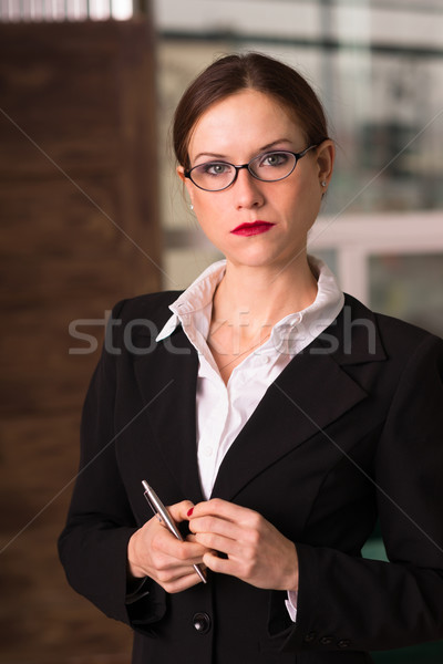 Vonzó barna hajú női üzletasszony igazgató iroda Stock fotó © cboswell