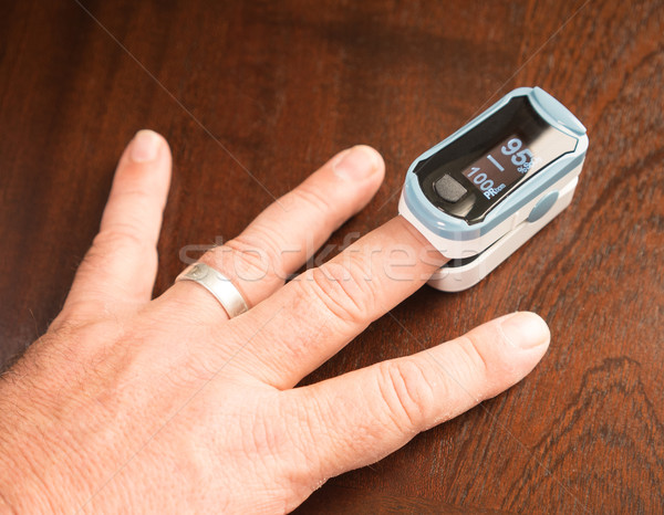 Fingertip Oxygen Sensor Pulse Rate Health Testor Oximeter Stock photo © cboswell