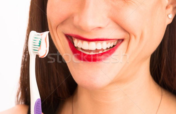 Vonzó nő csodálatos mosoly felnőtt női fogmosás Stock fotó © cboswell