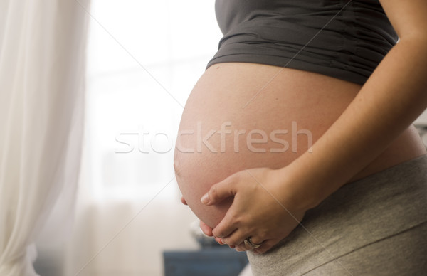 Big Belly Mother Seven Months Pregnant on Second Pregnancy Stock photo © cboswell