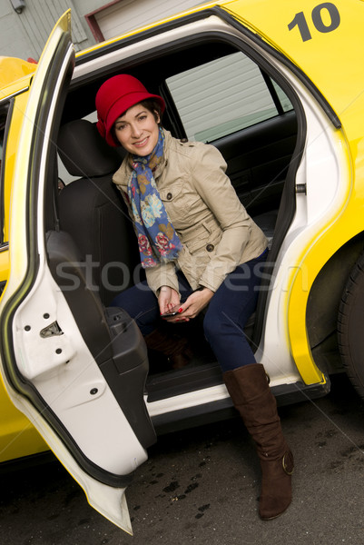 Donna taxi bella donna giallo auto sorriso Foto d'archivio © cboswell