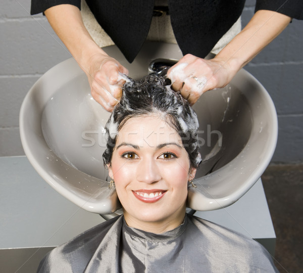 Attractive Woman Gets Spa Salon Shampoo and Conditioning Stock photo © cboswell