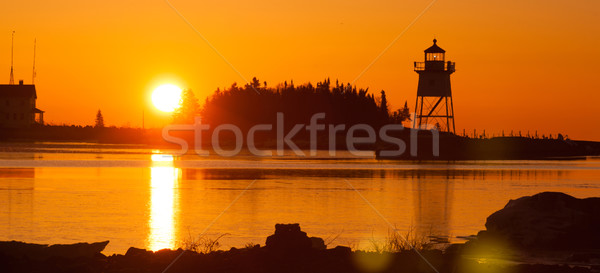 Manhã luz porto farol lago sol Foto stock © cboswell