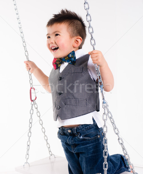 Boldog fiatal srác hinta felfüggesztett mozog nevet Stock fotó © cboswell