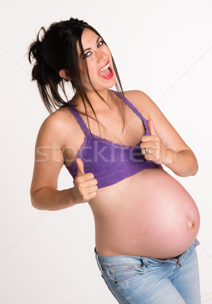Vonzó terhes nő kéz jel remek befejezés Stock fotó © cboswell