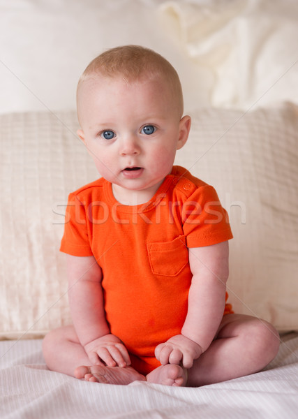 Young Blue Eyed Infant Boy Sitting up Looking at Camera Stock photo © cboswell