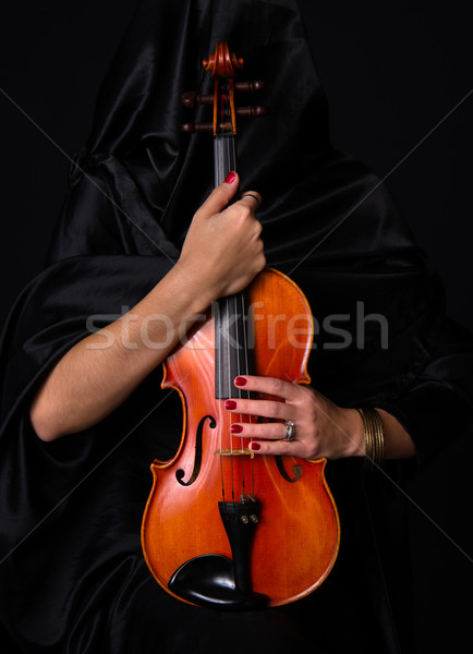 Female Violinist Holds Bow Across Saturated Musical Violin Acoustic Stock photo © cboswell